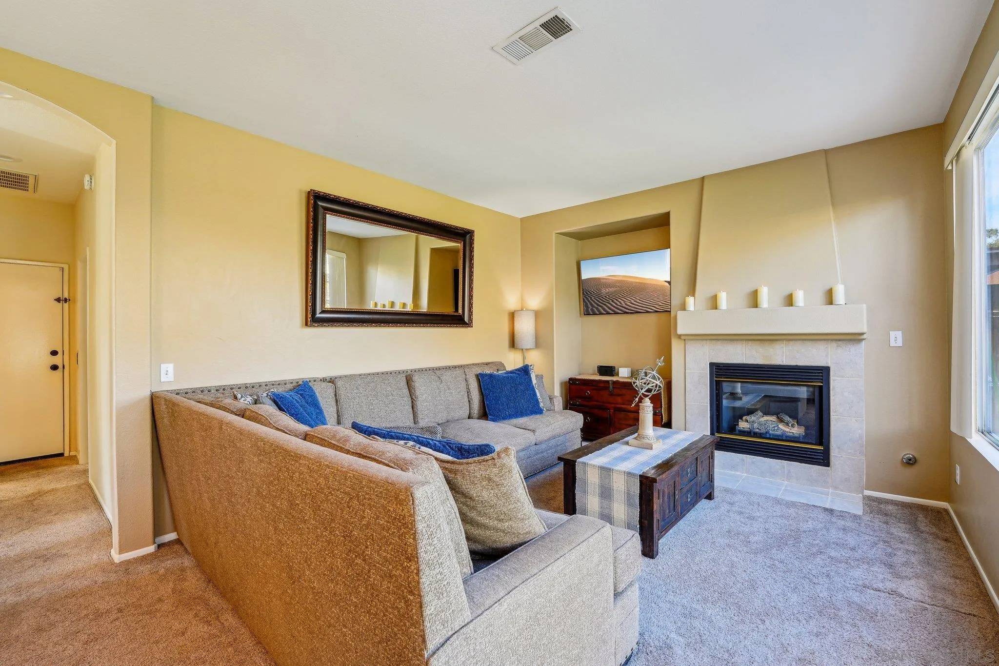 43166 Sereno Drive Temecula, CA 92592 - Photo 21 of 44 a living room with furniture and a fireplace