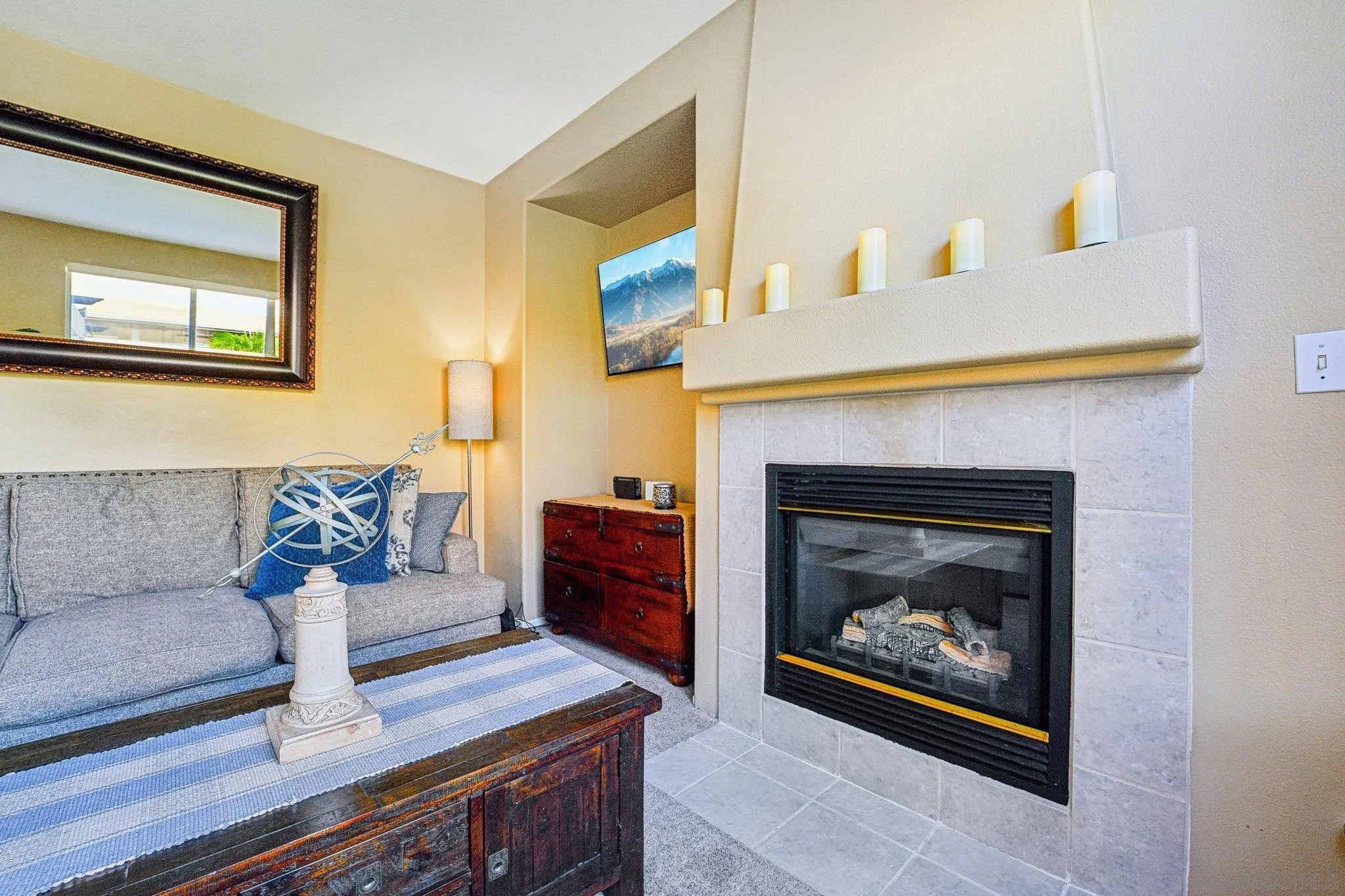 43166 Sereno Drive Temecula, CA 92592 - Photo 23 of 44 a living room with furniture and a fireplace