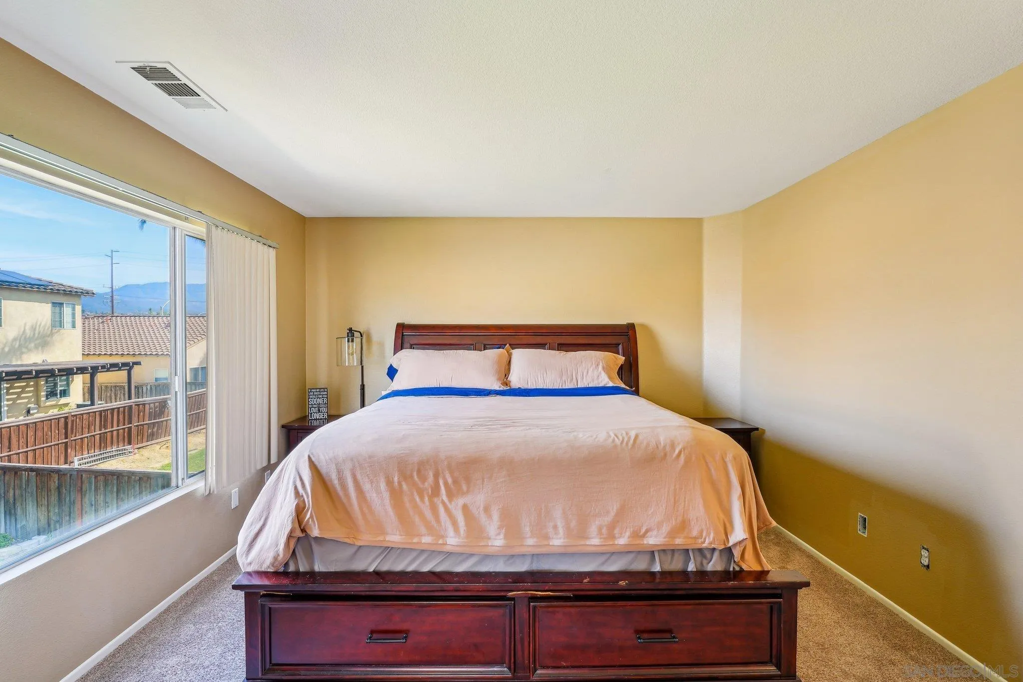 43166 Sereno Drive Temecula, CA 92592 - Photo 24 of 44 a bedroom with a bed and wooden floor