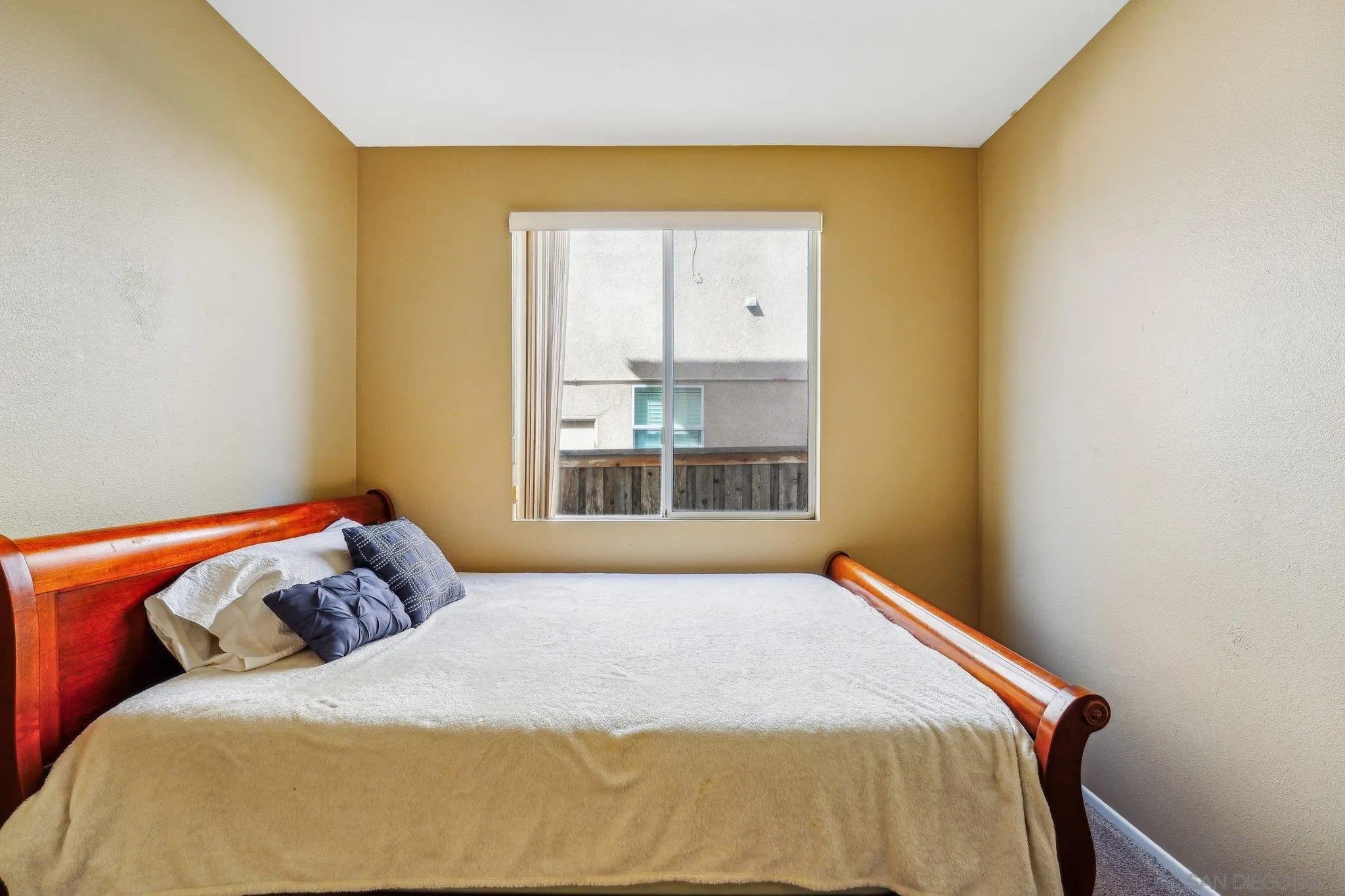 43166 Sereno Drive Temecula, CA 92592 - Photo 34 of 44 a bedroom with a bed and window