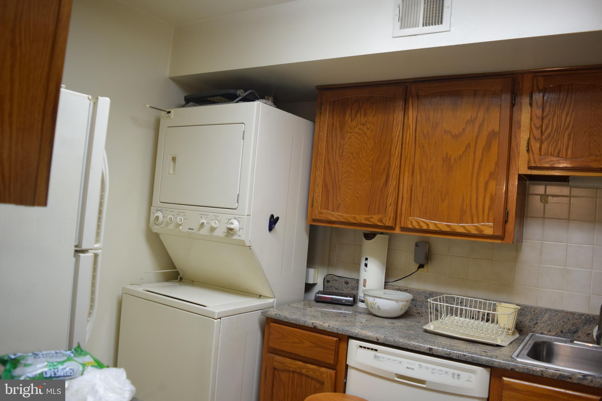 2123 Young Street Southeast, Unit 203 Washington, DC 20020 - Photo 3 of 10 a utility room with dryer and washer