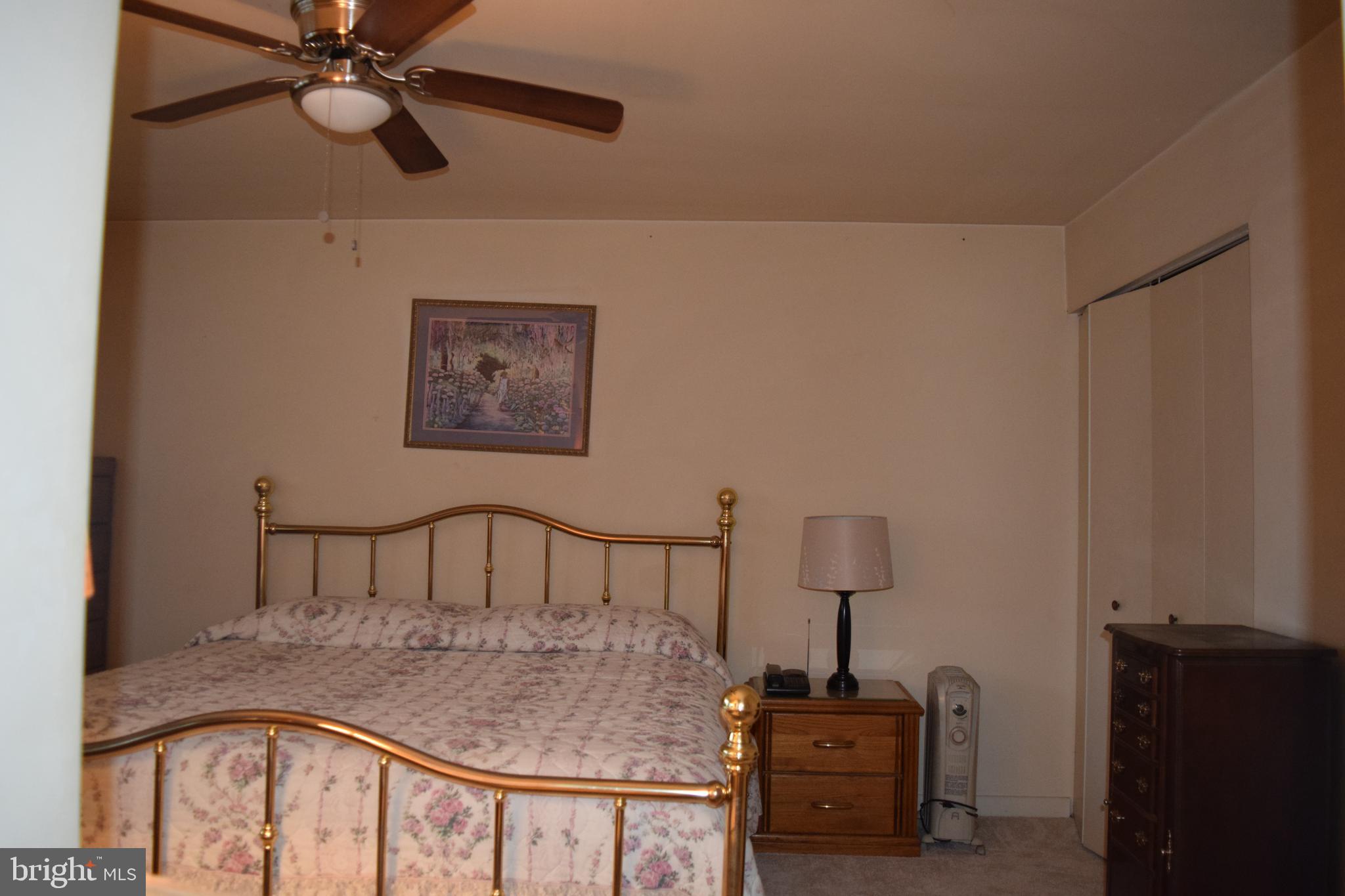 2123 Young Street Southeast, Unit 203 Washington, DC 20020 - Photo 5 of 10 a bedroom with a bed and a window