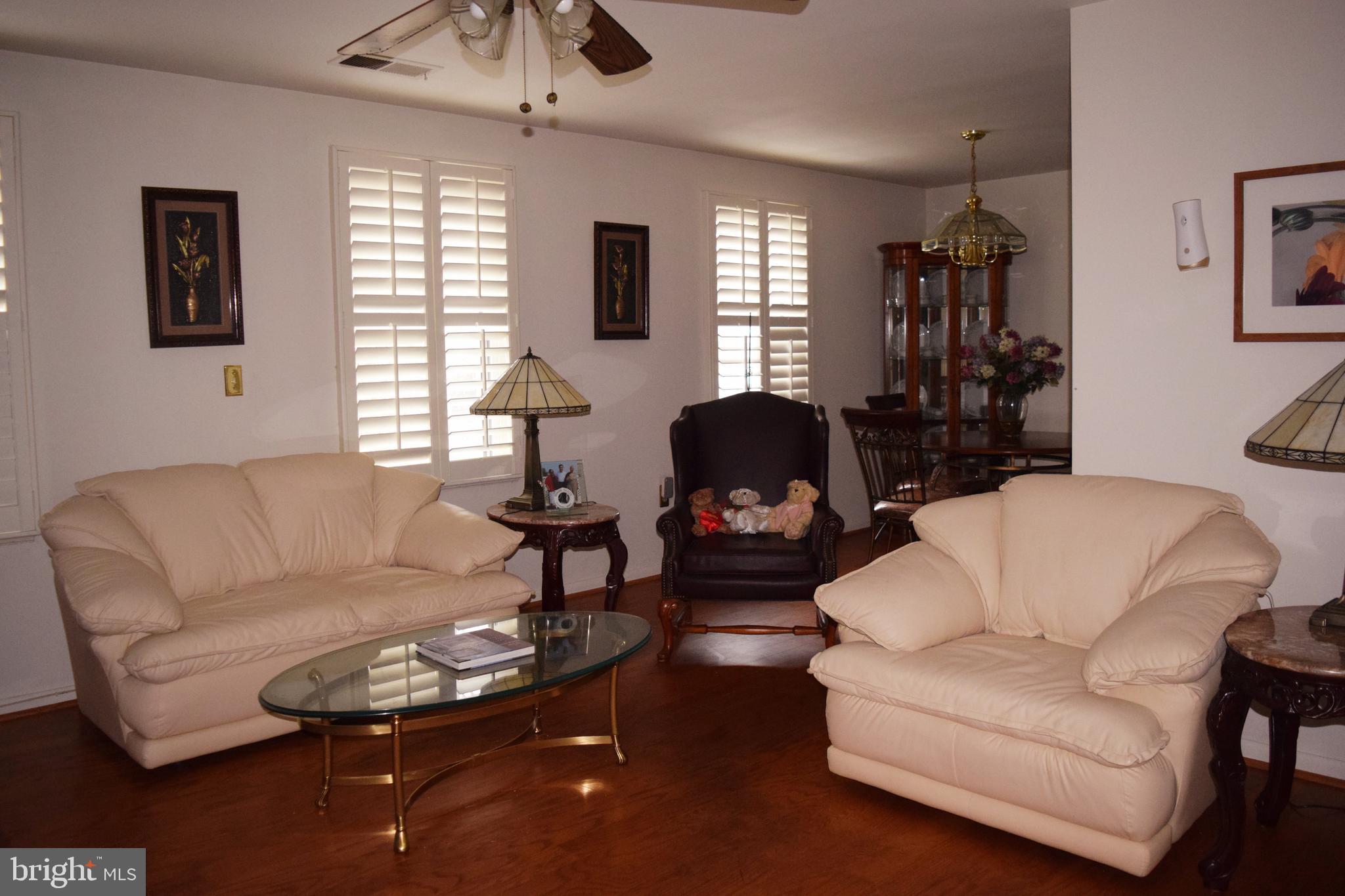 2123 Young Street Southeast, Unit 203 Washington, DC 20020 - Photo 8 of 10 a living room with furniture and a window