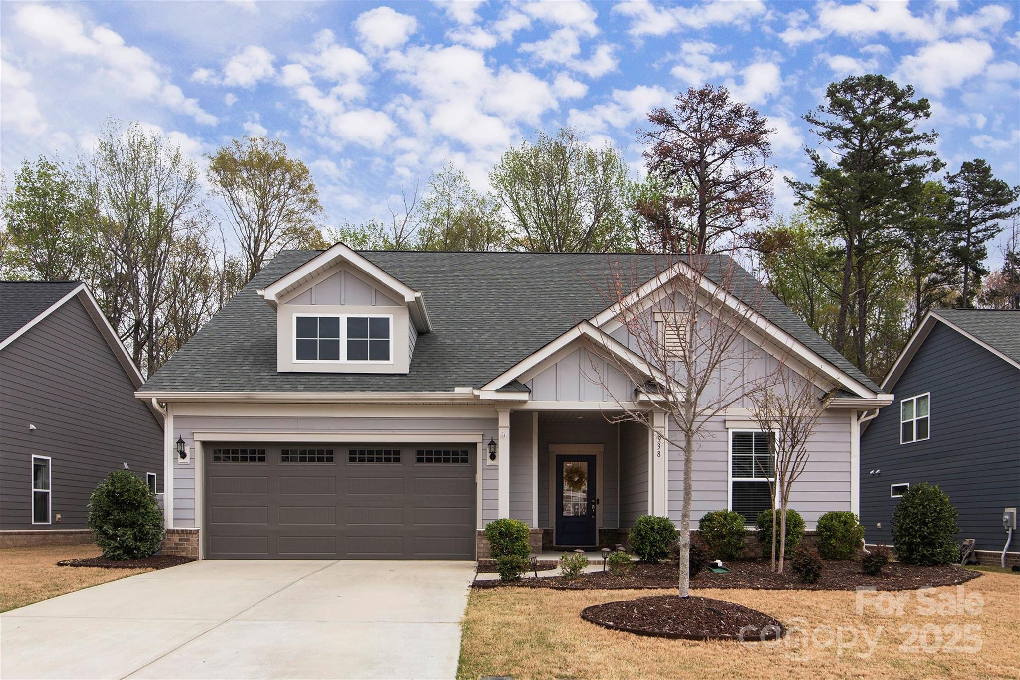 938 Moose Trail Matthews, NC 28104 - Photo 1 of 23 a front view of a house with garden