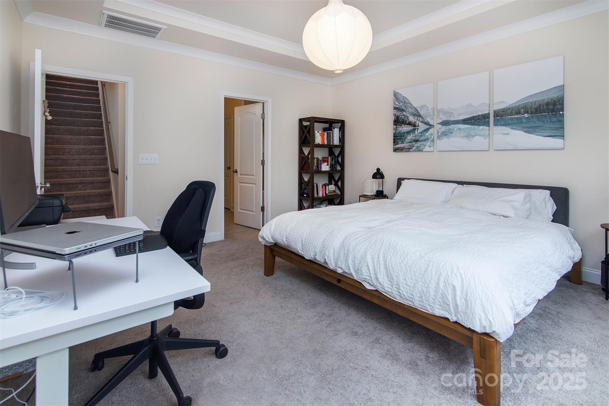 938 Moose Trail Matthews, NC 28104 - Photo 12 of 23 a bedroom with a bed a desk and chair