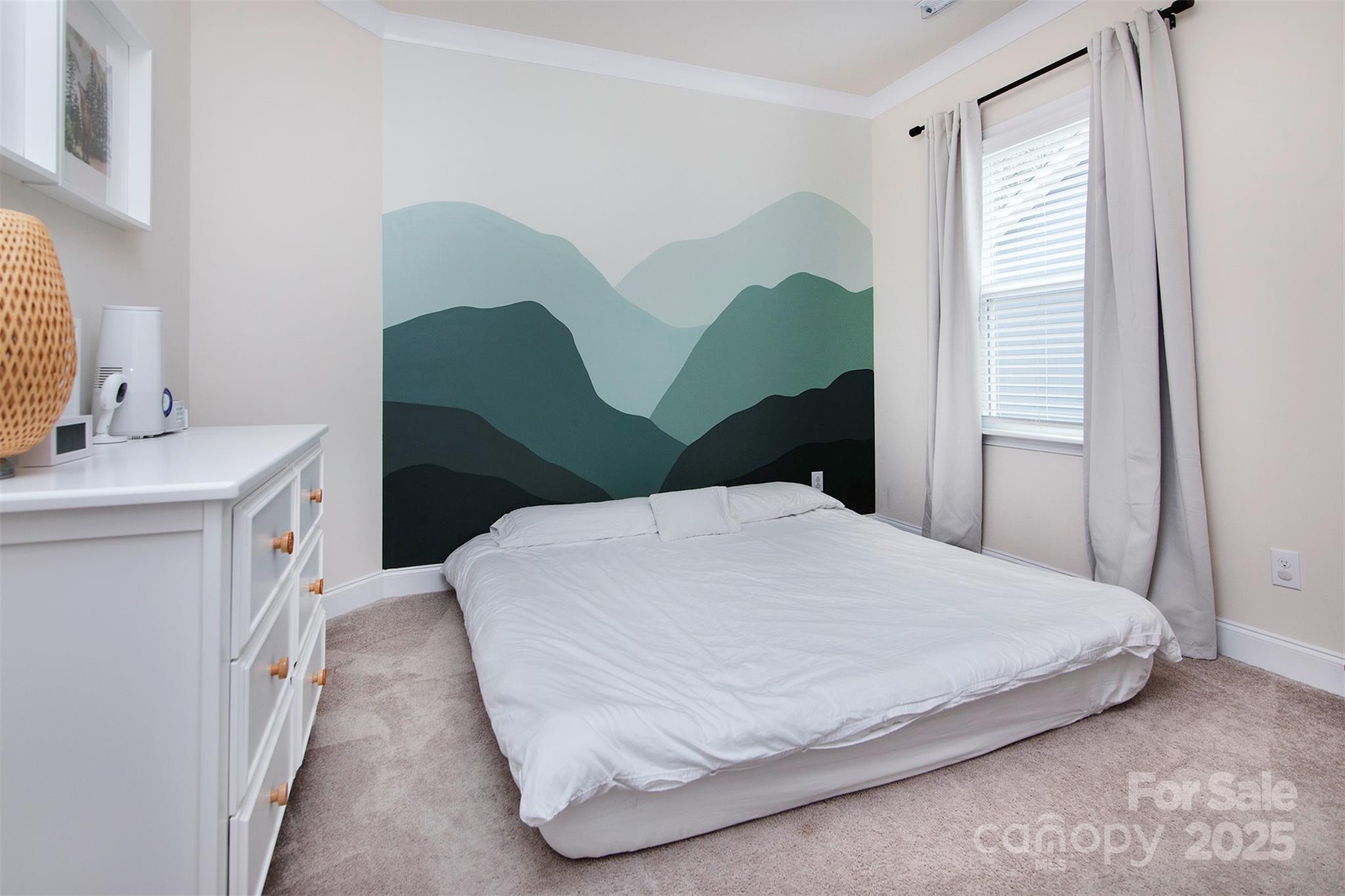 938 Moose Trail Matthews, NC 28104 - Photo 17 of 23 a bedroom with a bed and a window