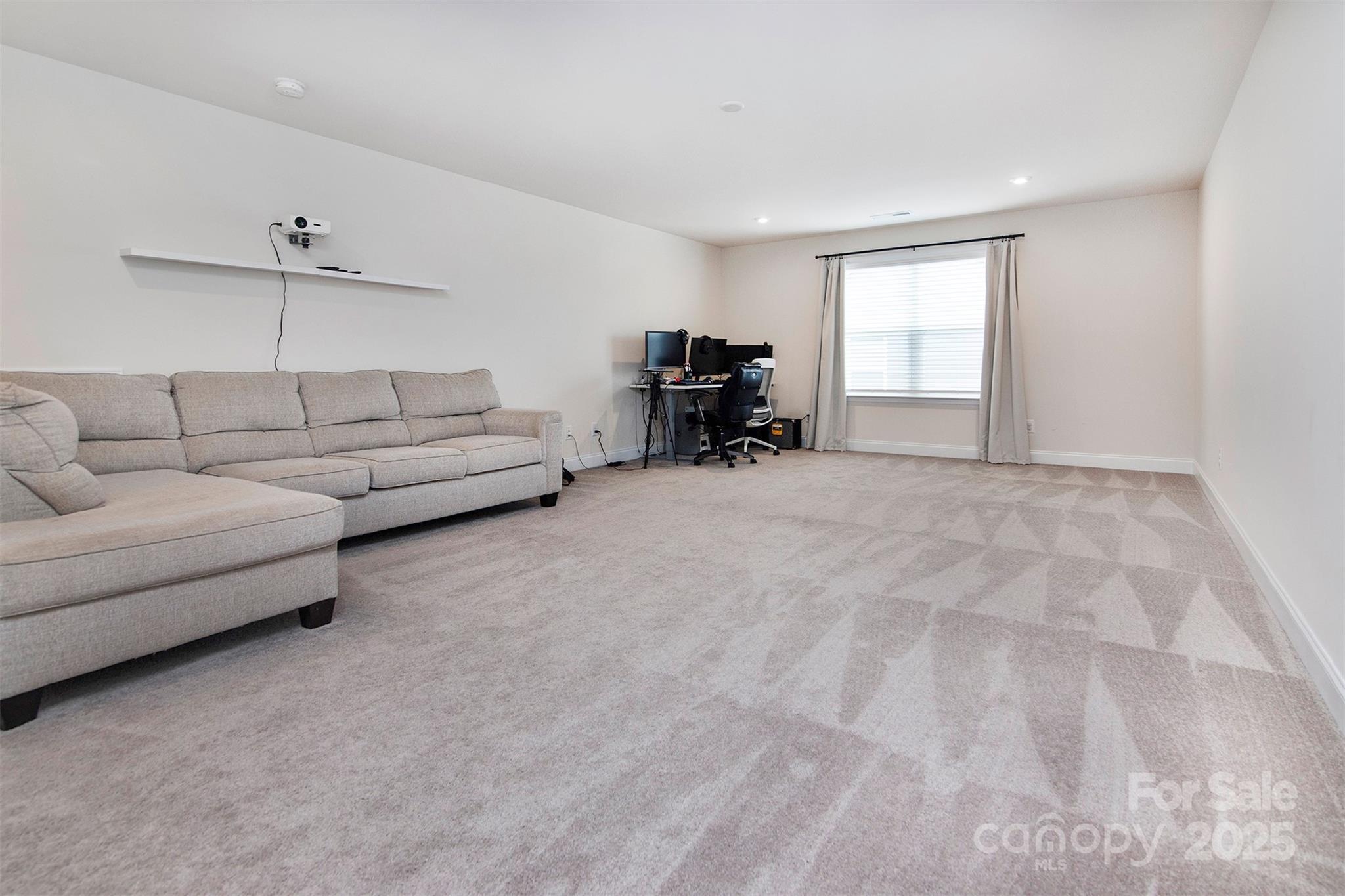 938 Moose Trail Matthews, NC 28104 - Photo 20 of 23 a living room with furniture and a window
