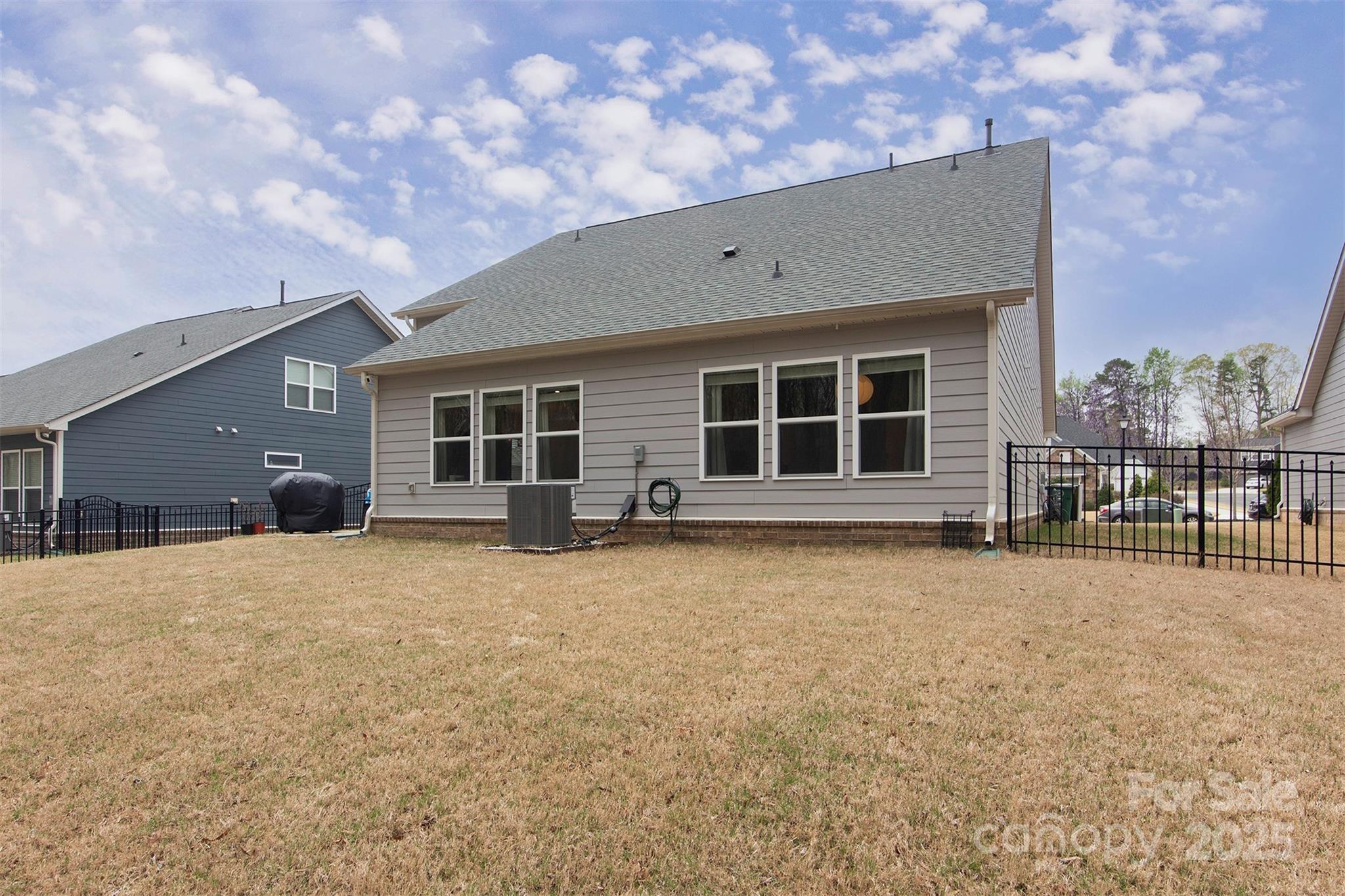 938 Moose Trail Matthews, NC 28104 - Photo 21 of 23 a front view of a house with a yard and garage