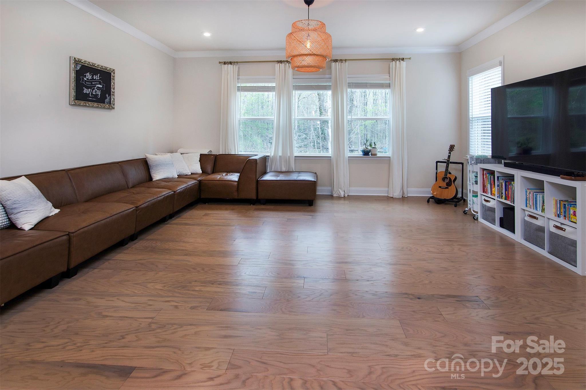 938 Moose Trail Matthews, NC 28104 - Photo 7 of 23 a living room with furniture and a flat screen tv