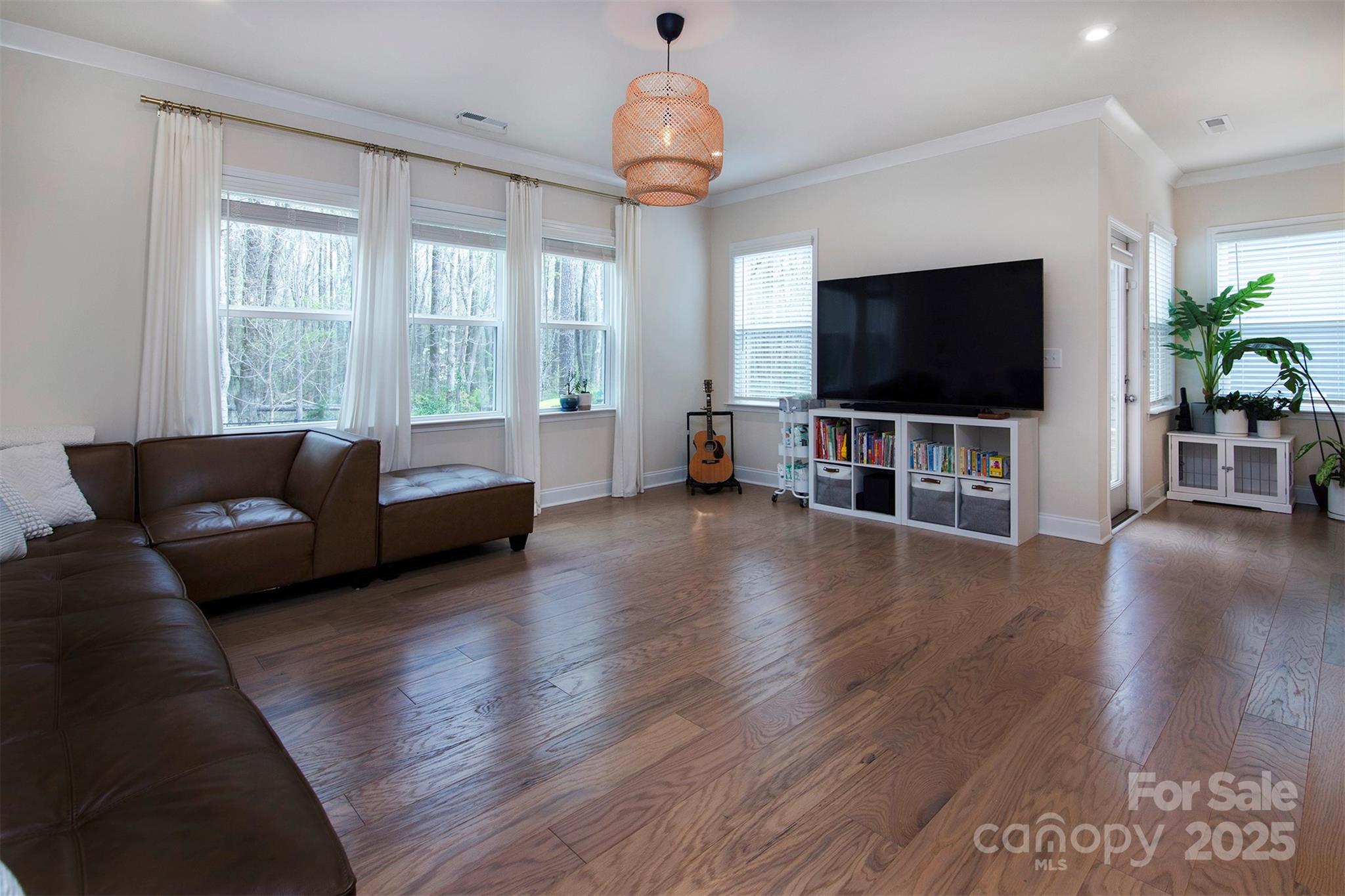 938 Moose Trail Matthews, NC 28104 - Photo 8 of 23 a living room with furniture and a flat screen tv