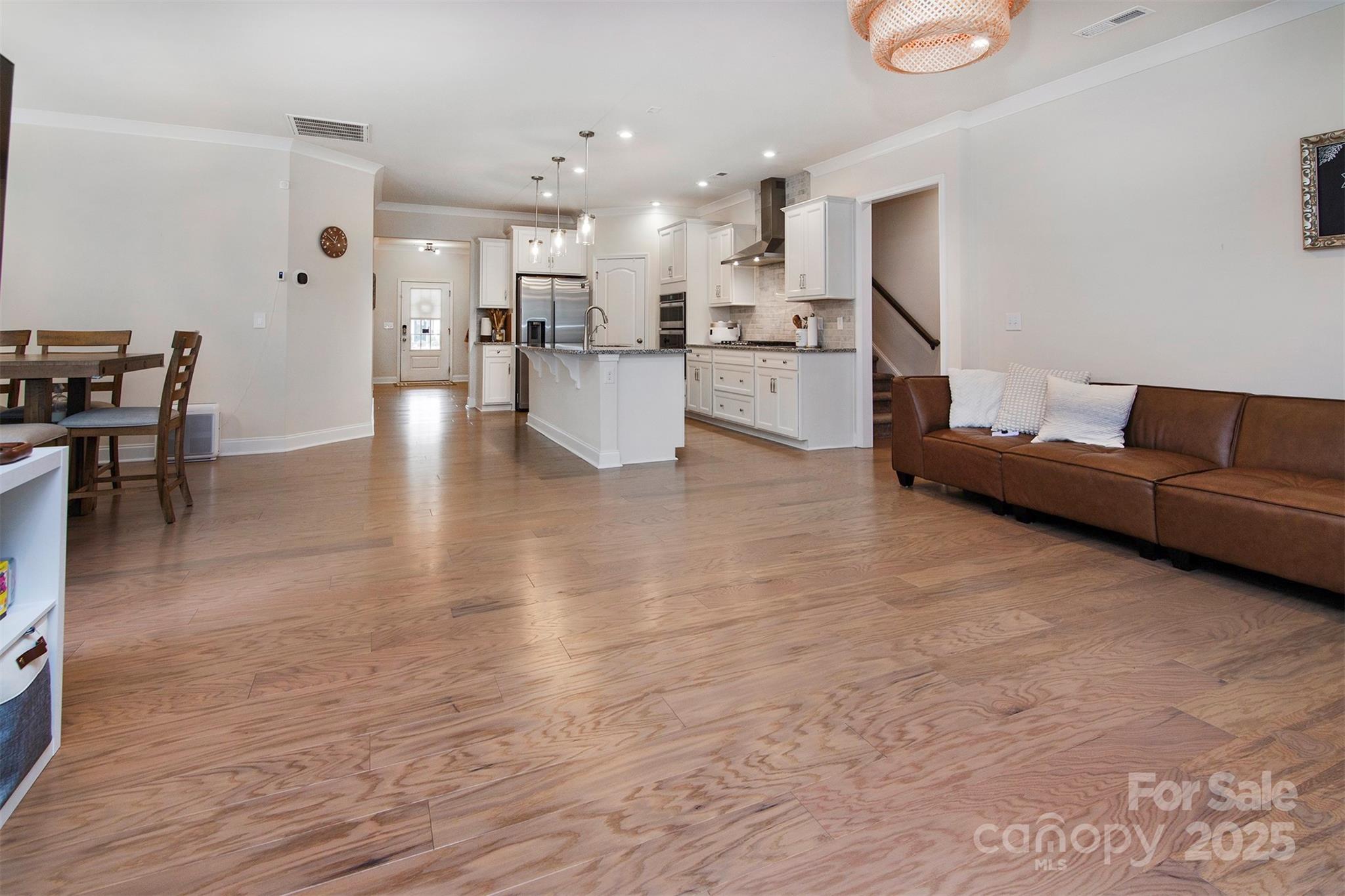 938 Moose Trail Matthews, NC 28104 - Photo 10 of 23 a living room with furniture and kitchen view