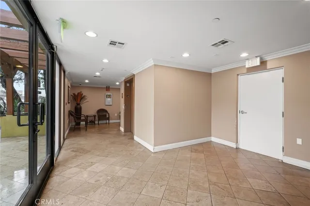 a view of a hallway with dining area