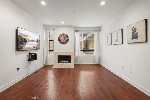 a view of a livingroom with an empty space and a fireplace