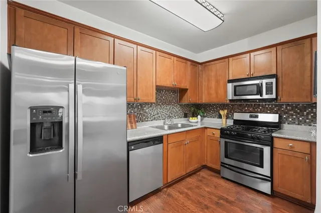 a kitchen with a refrigerator stove and microwave