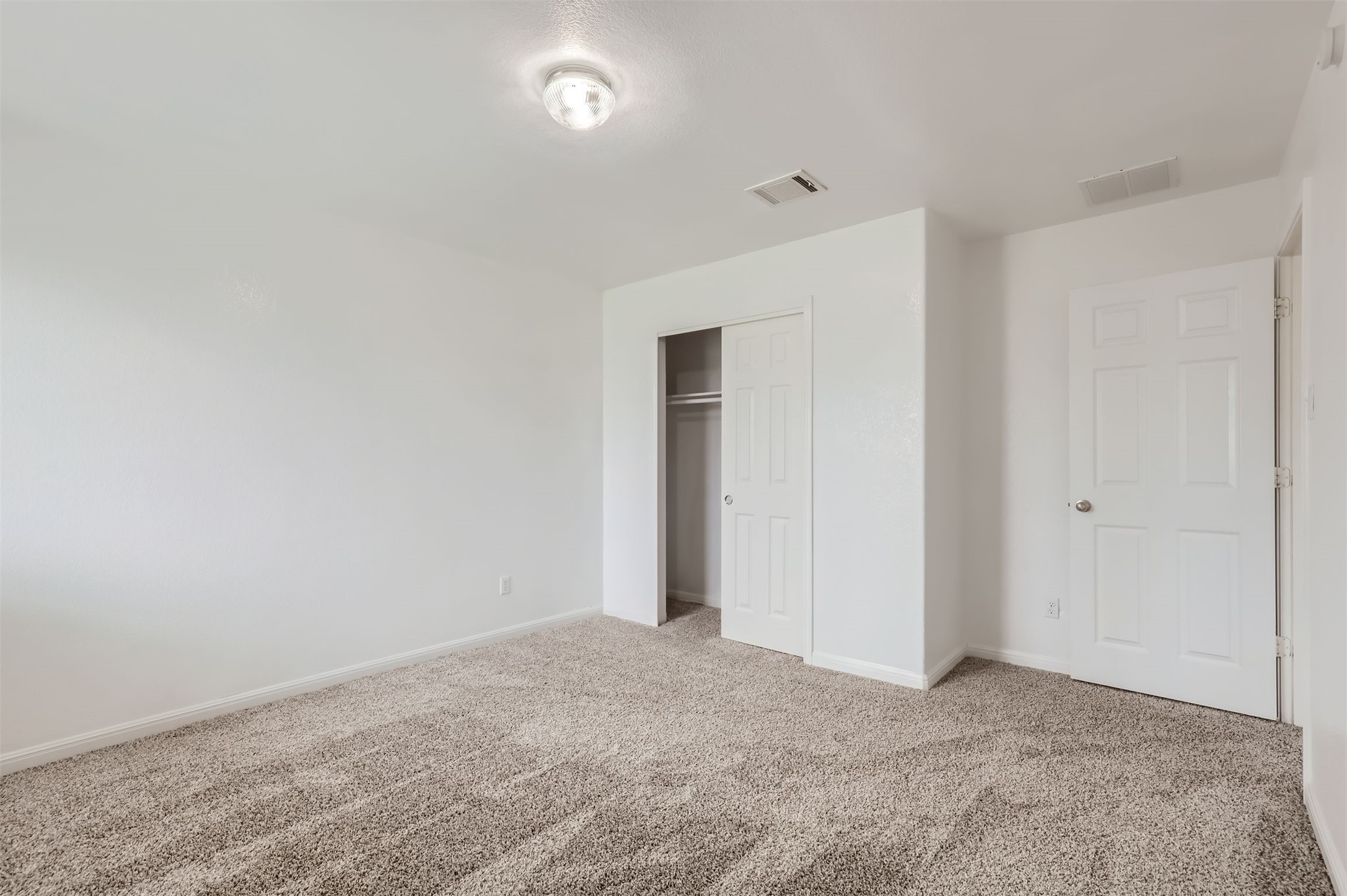 131 Lavaca Loop Hutto, TX 78634 - Photo 20 of 29 An inviting room awaits personal touches with fresh carpet and a convenient sliding closet.