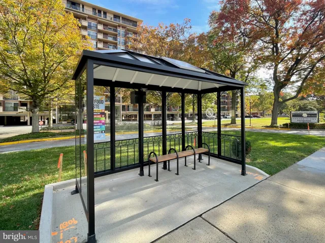 a view of a patio with a table chairs and a yard