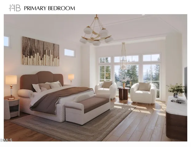 a spacious bedroom with a balcony a bed and a chandelier