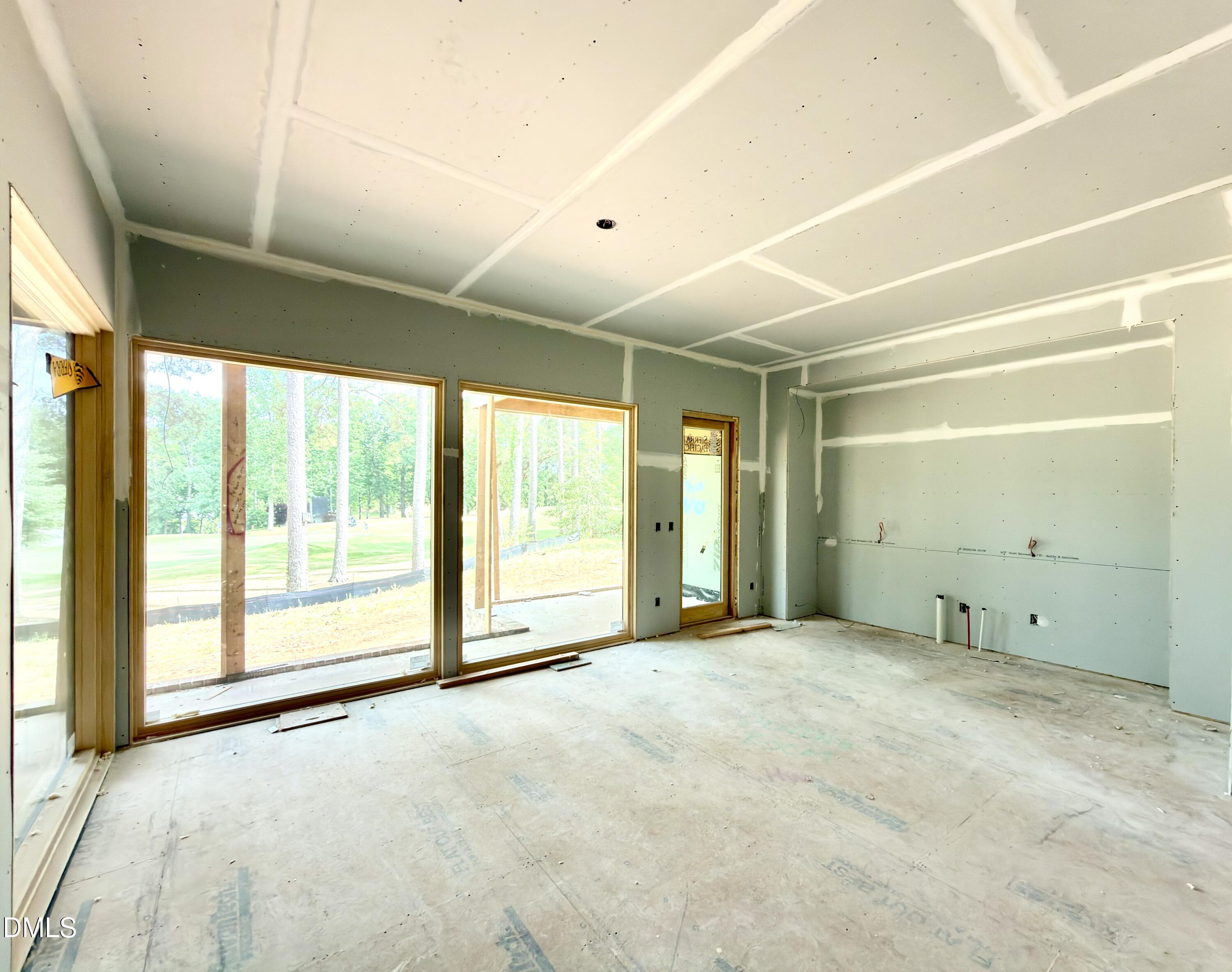 7136 North Ridge Drive Raleigh, NC 27615 - Photo 24 of 68 a view of an empty room with a sliding door