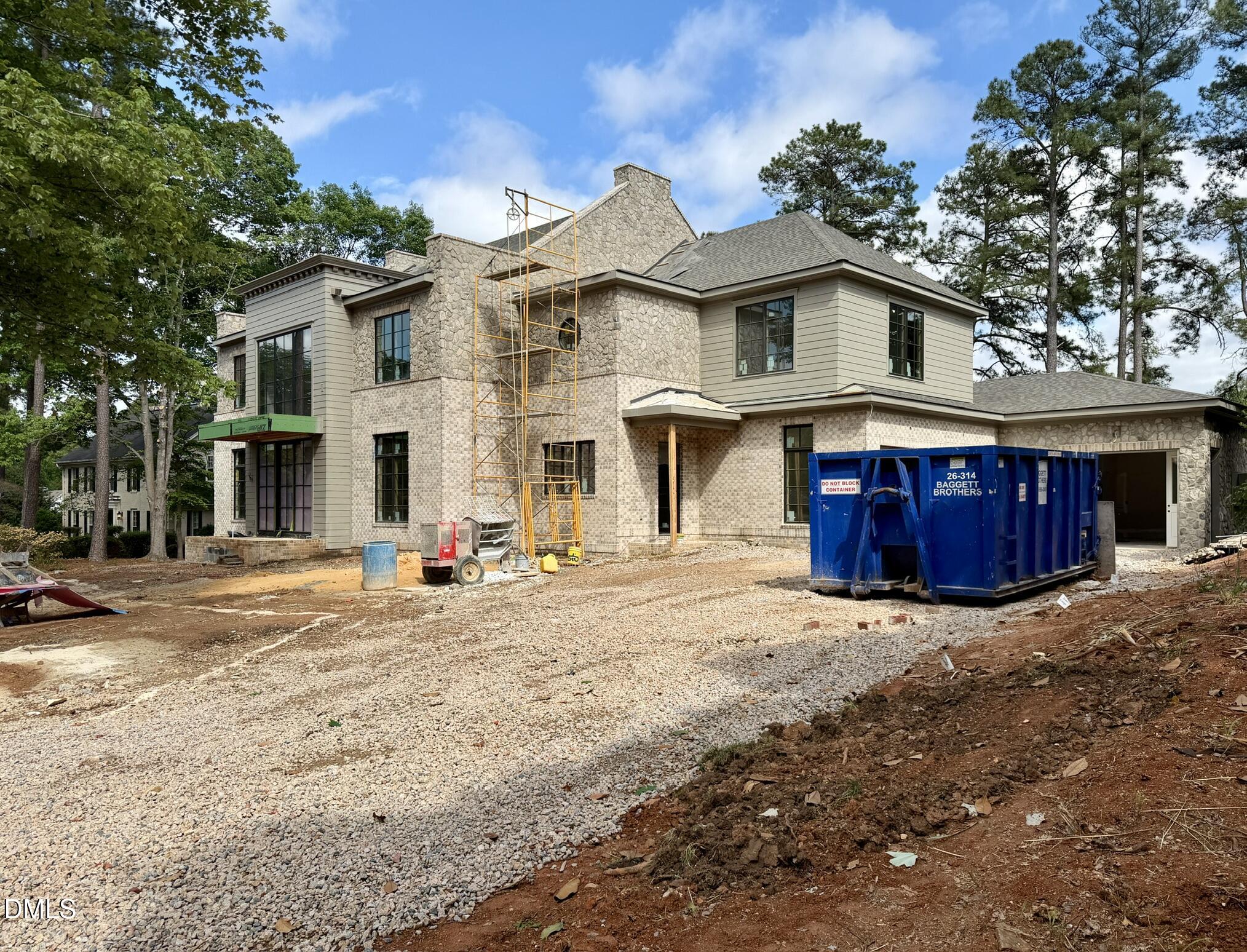 7136 North Ridge Drive Raleigh, NC 27615 - Photo 3 of 68 a view of a white house with large trees and outdoor space