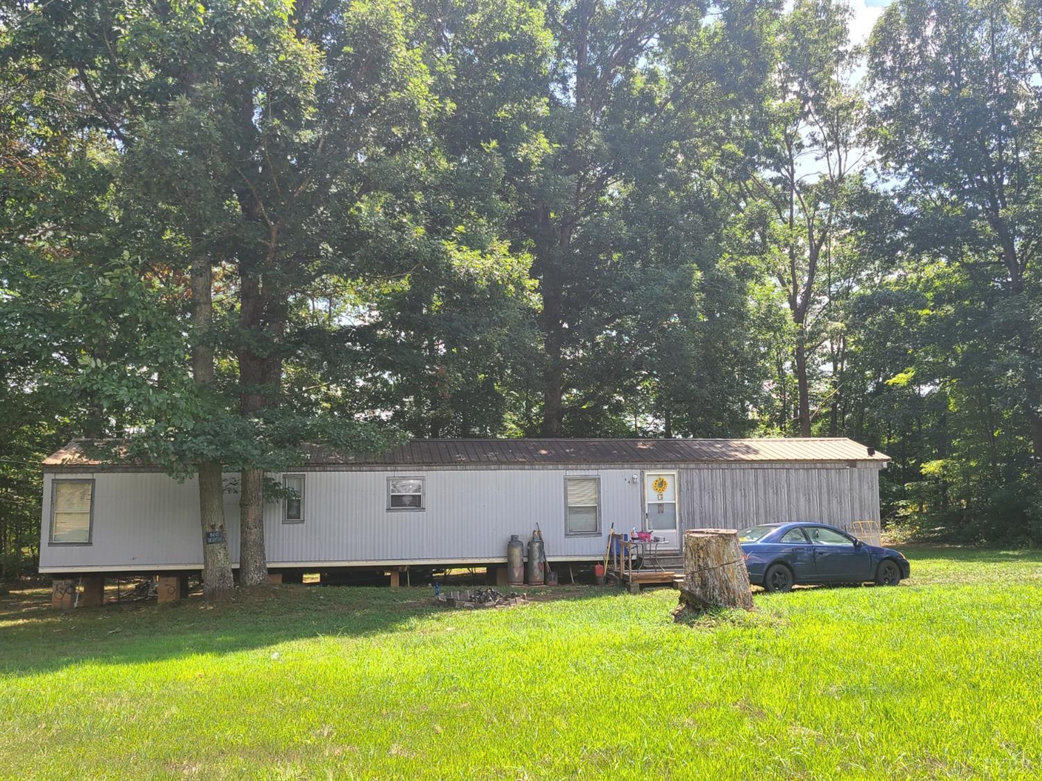 108 Applegate Road Appomattox, VA 24522 - Photo 22 of 22 a view of a house with a big yard and a large tree