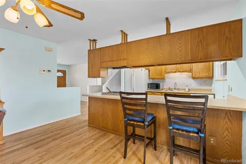 a workspace with furniture and wooden floor