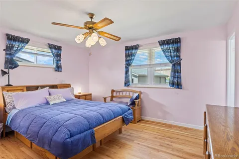 a bedroom with bed and window