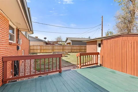 a view of a porch with wooden floor