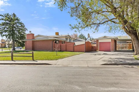a house that has a tree in front of it