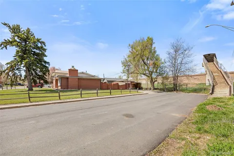 a view of a park with large trees