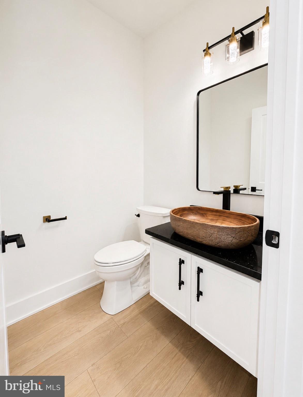 21963 Hardscrabble Road Georgetown, DE 19947 - Photo 15 of 43 Sleek modern bathroom with natural accents.