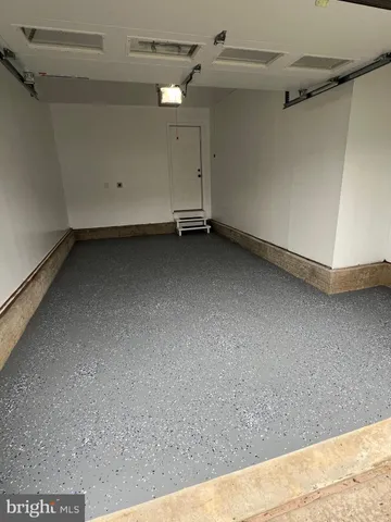 a white toilet sitting in a bathroom next to a sink