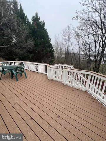 a kitchen with granite countertop a stove a sink and a microwave