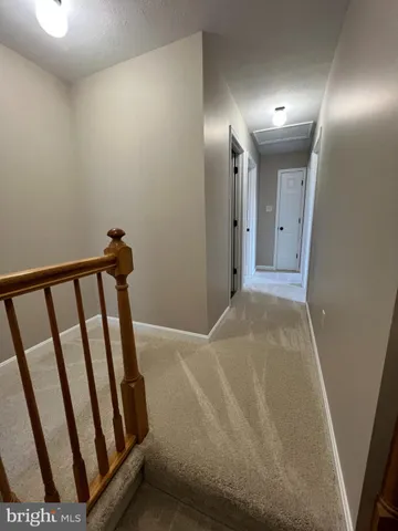 a view of an empty room with windows