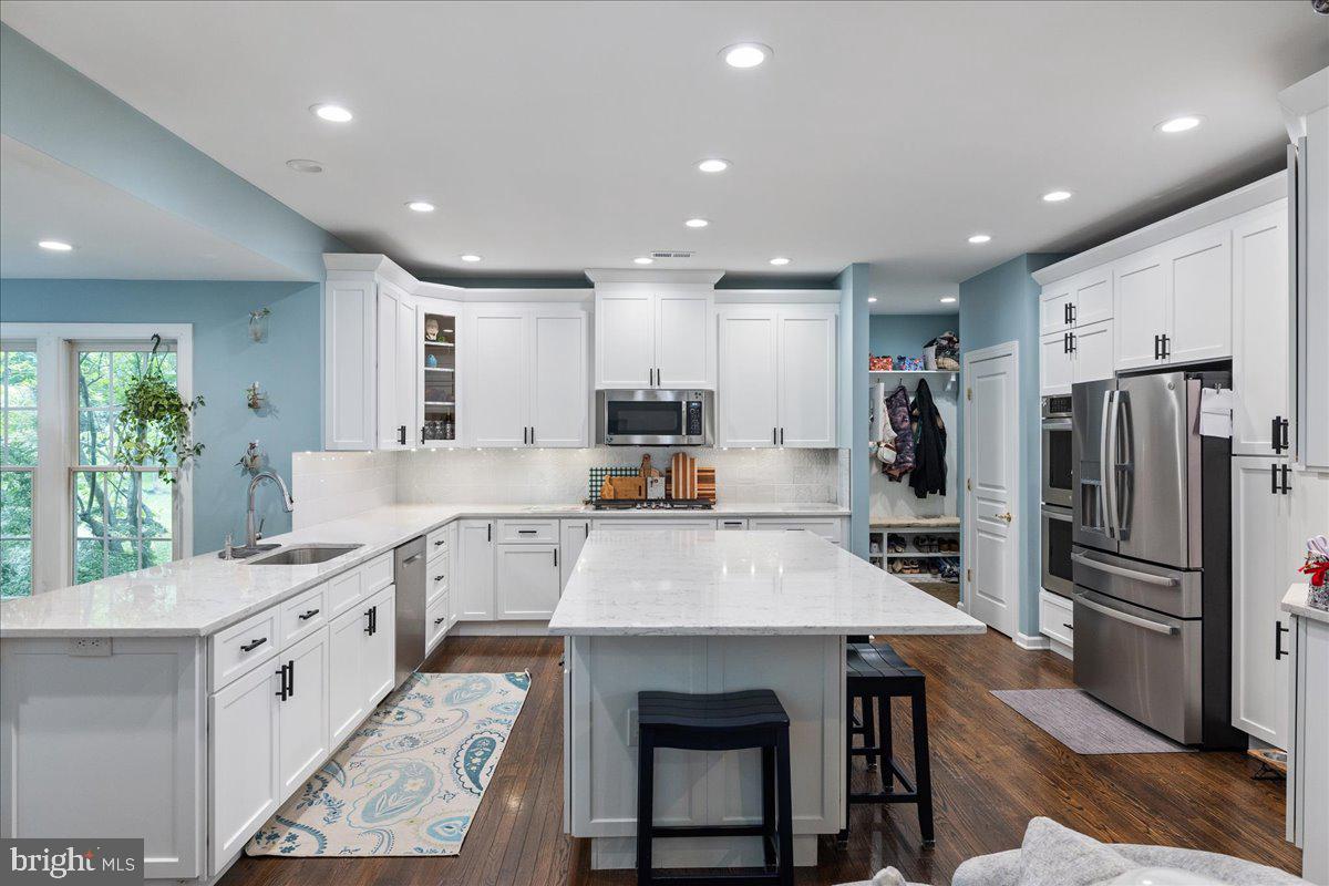 10 Eagleton Farm Road Newtown, PA 18940 - Photo 14 of 39 a large kitchen with stainless steel appliances lots of counter space and windows