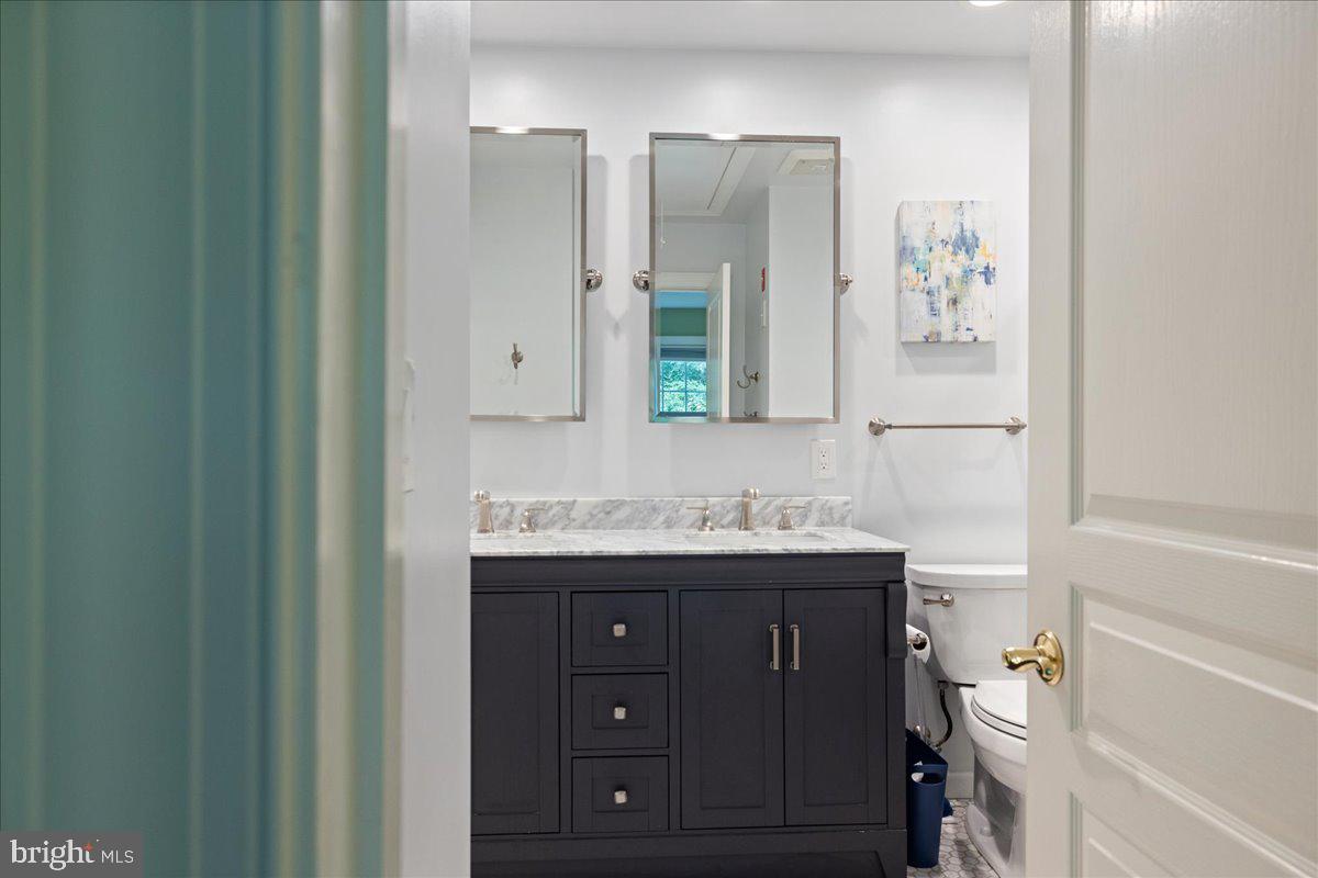 10 Eagleton Farm Road Newtown, PA 18940 - Photo 27 of 39 a bathroom with a granite countertop sink a toilet and a mirror