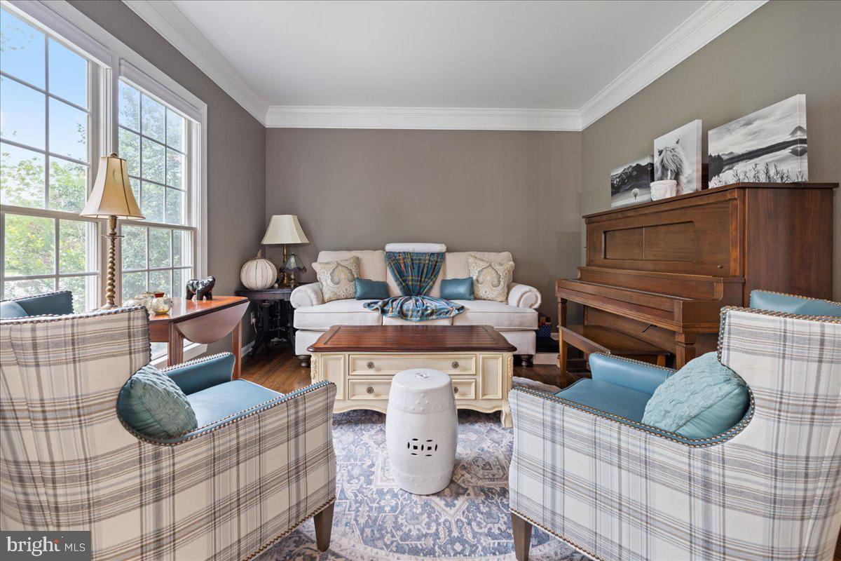 10 Eagleton Farm Road Newtown, PA 18940 - Photo 5 of 39 a living room with furniture a rug and a floor to ceiling window
