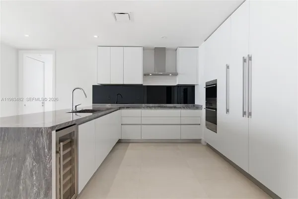 a bathroom with a double vanity sink and mirror