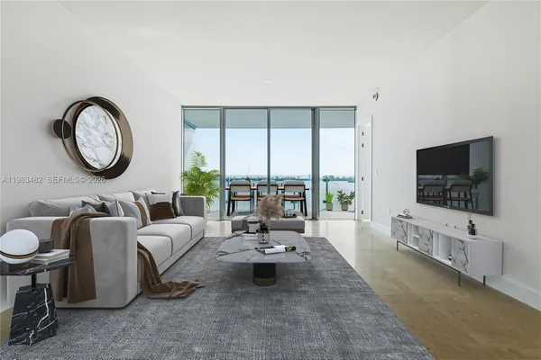 a living room with furniture and a flat screen tv