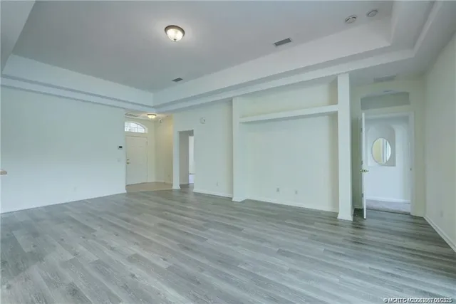 a spacious bathroom with a sink a mirror and a bathtub