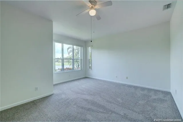 a bathroom with a shower sink and mirror