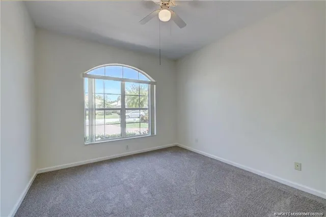a view of an empty room and closet area