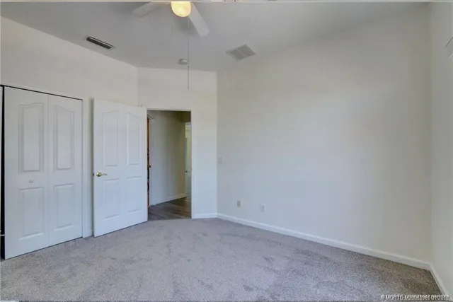 a bathroom with a sink a toilet and shower curtain