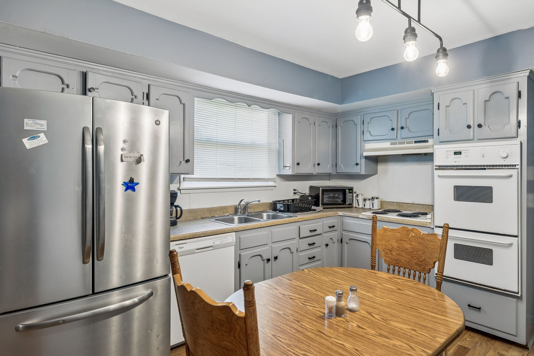 1246 Apache Lane Madison, TN 37115 - Photo 6 of 21 a kitchen with stainless steel appliances a refrigerator sink and cabinets