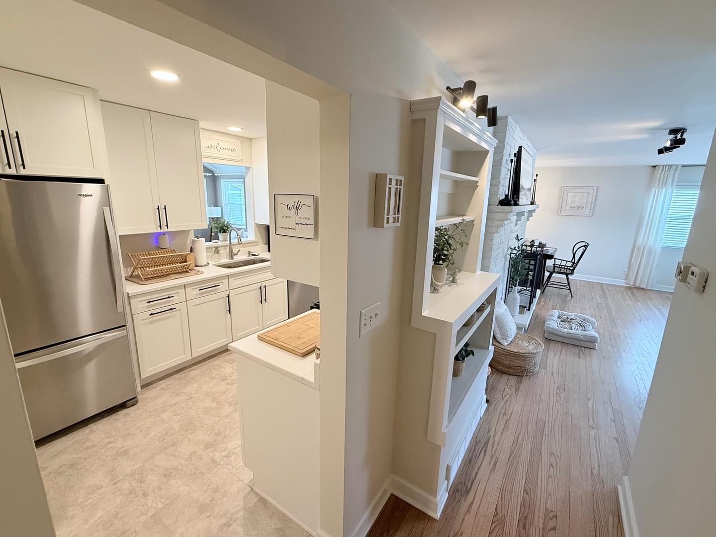 515 Roberts Lane Batavia, IL 60510 - Photo 12 of 42 a kitchen with a sink a refrigerator and wooden floor
