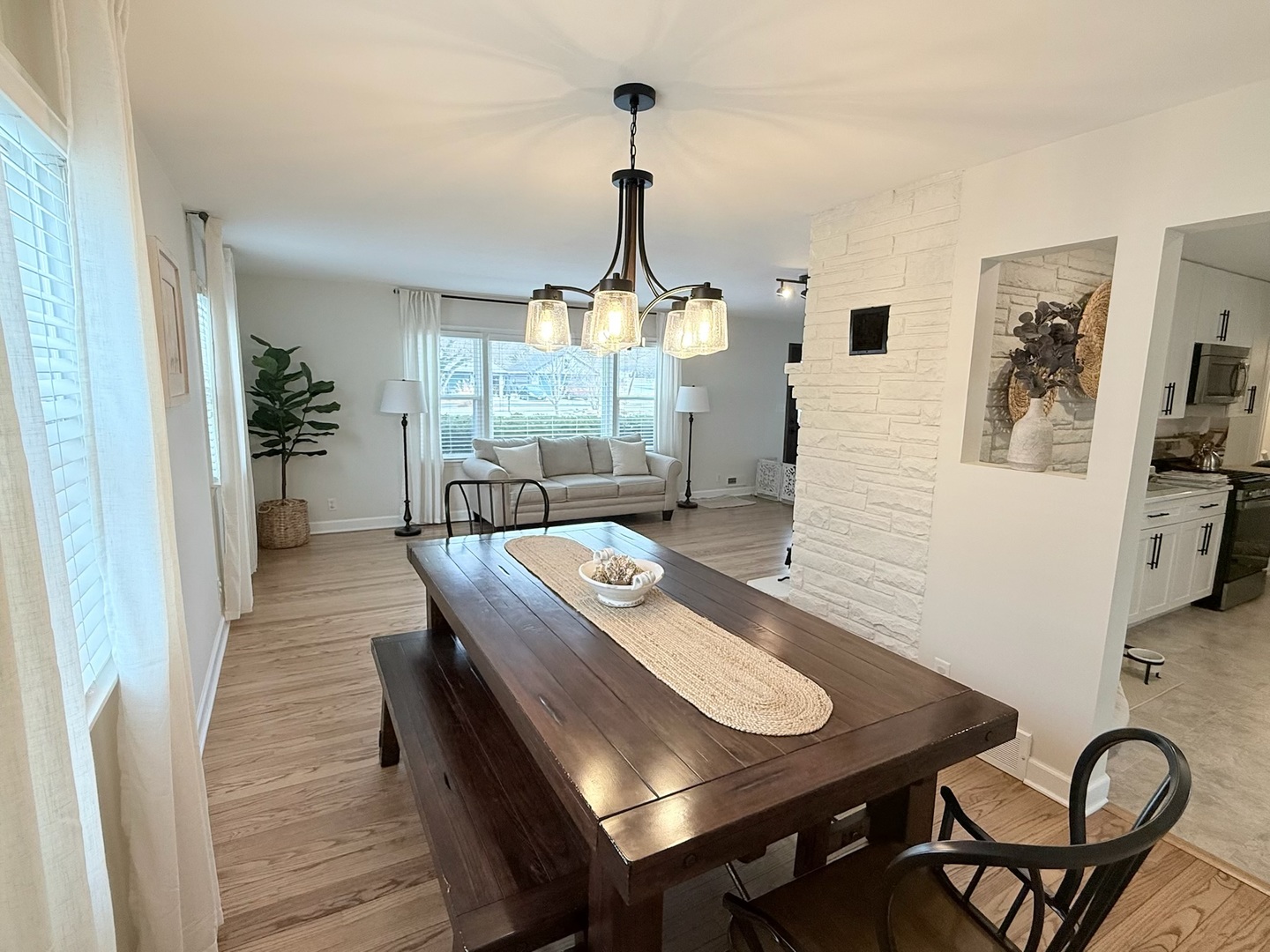 515 Roberts Lane Batavia, IL 60510 - Photo 14 of 42 a view of a dining room with furniture wooden floor and chandelier