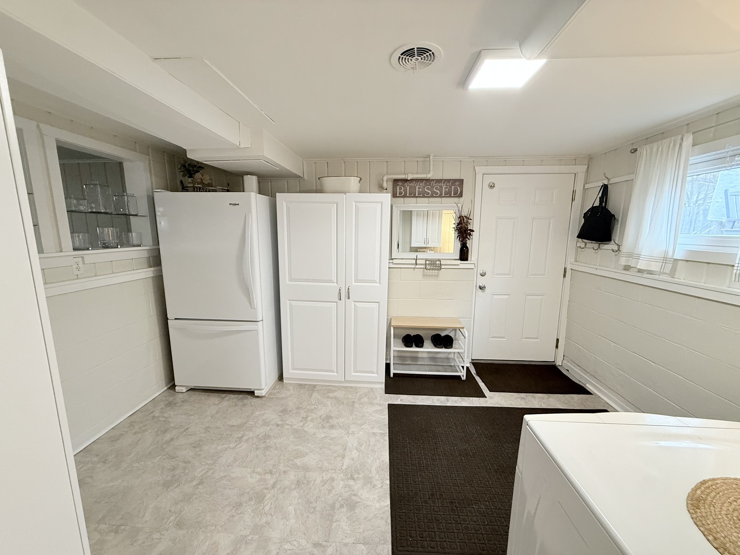 515 Roberts Lane Batavia, IL 60510 - Photo 38 of 42 a kitchen with a refrigerator a stove top oven a sink and white cabinets