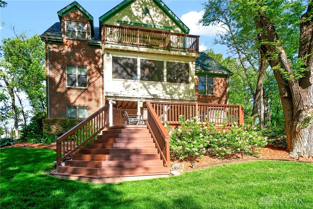 330 South Alpha Bellbrook Road Bellbrook, OH 45305 - Photo 61 of 87 This residence features a large deck and balcony, perfect for enjoying the serene backyard.