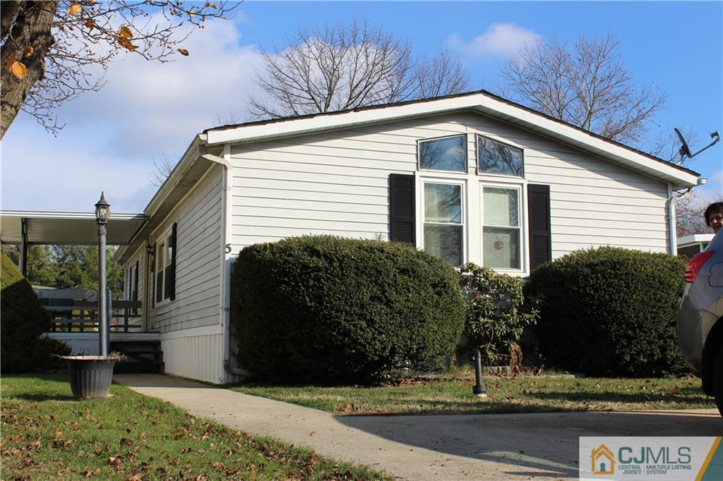 5 Poe Road North Brunswick, NJ 08902 - Photo 1 of 10 a view of a house with a yard