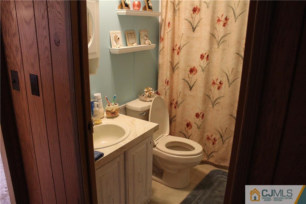 5 Poe Road North Brunswick, NJ 08902 - Photo 3 of 10 a bathroom with a sink and a toilet