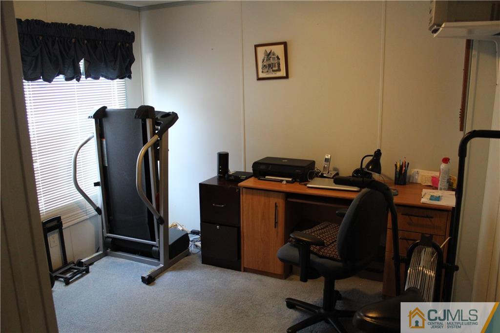 5 Poe Road North Brunswick, NJ 08902 - Photo 5 of 10 a view of workspace with mirror wall